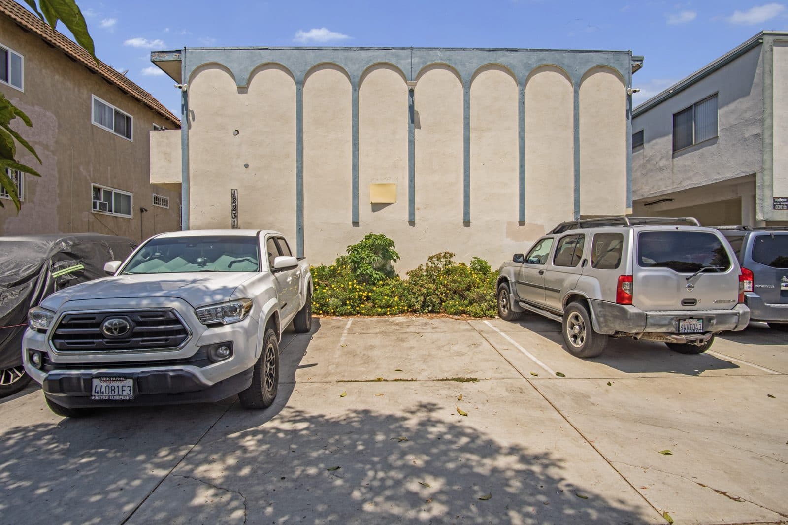 Street-facing arcaded elevation and resident parking