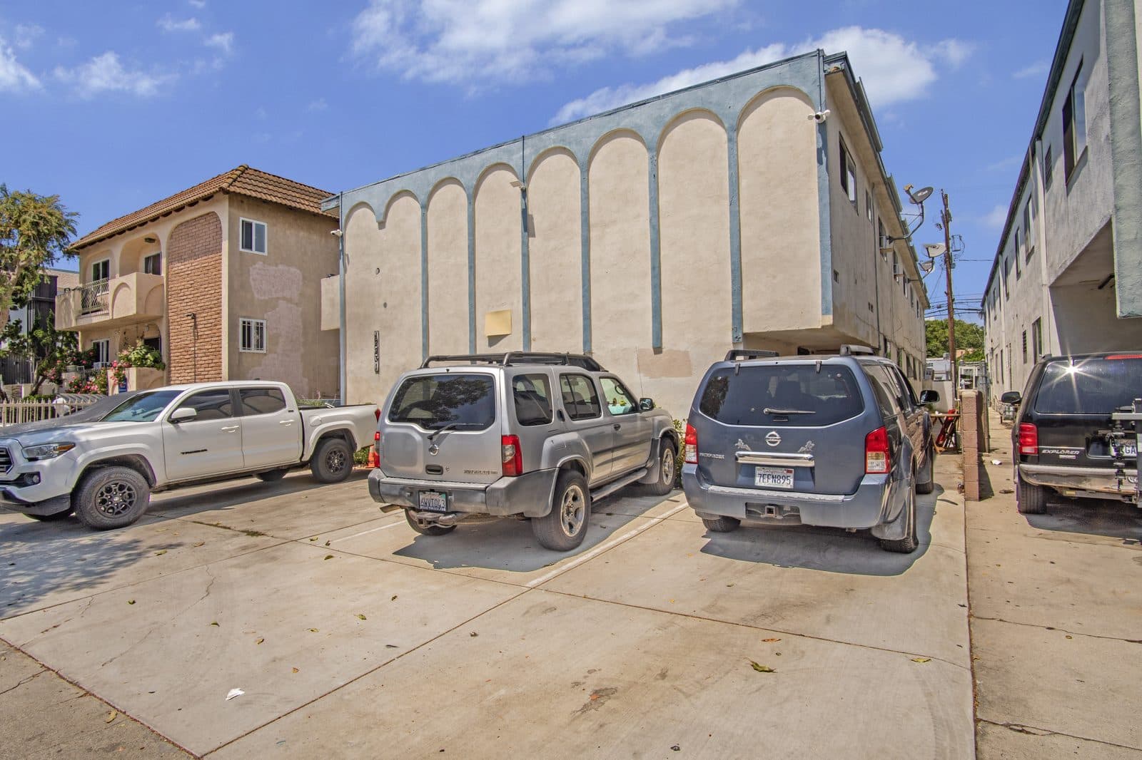 Arcaded facade from the north with resident parking