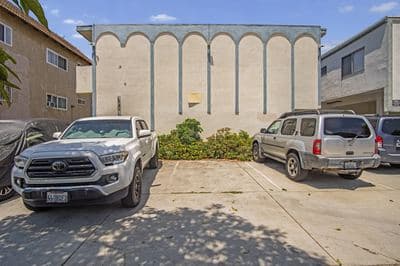 Street-facing arcaded elevation and resident parking
