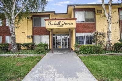 Front entry under the Newhall Terrace sign on Newhall Avenue